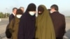 Таджикские женщины, доставленные из сирийского лагеря на родину 