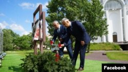 Ukraine - Armenian Ambassador Vladimir Karapetian and the head of Yerevan's Nor Nork district, Tigran Ter-Margarian, visit Bucha, May 31, 2024.