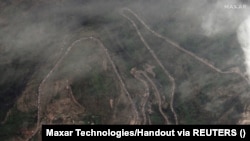 A satellite image shows a long traffic jam of vehicles along the Lachin corridor as ethnic Armenians flee from the Nagorno-Karabakh, September 26, 2023. 