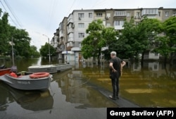 Затопленная улица в Херсоне, 10 июня 2023 года