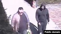 A still image taken from surveillance video allegedly showing Artyom Uss (R) escaping house arrest in Milan, Italy, on Mar. 22, 2023.