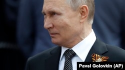 Президент Росії Володимир Путін з «георгіївською стрічкою». Москва, 9 травня 2019 року (ілюстраційне зображення)