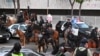 Mounted Police moves on to clear the street as curfew is in effect after days of protests in response to federal immigration operations in Los Angeles on June 10, 2025.